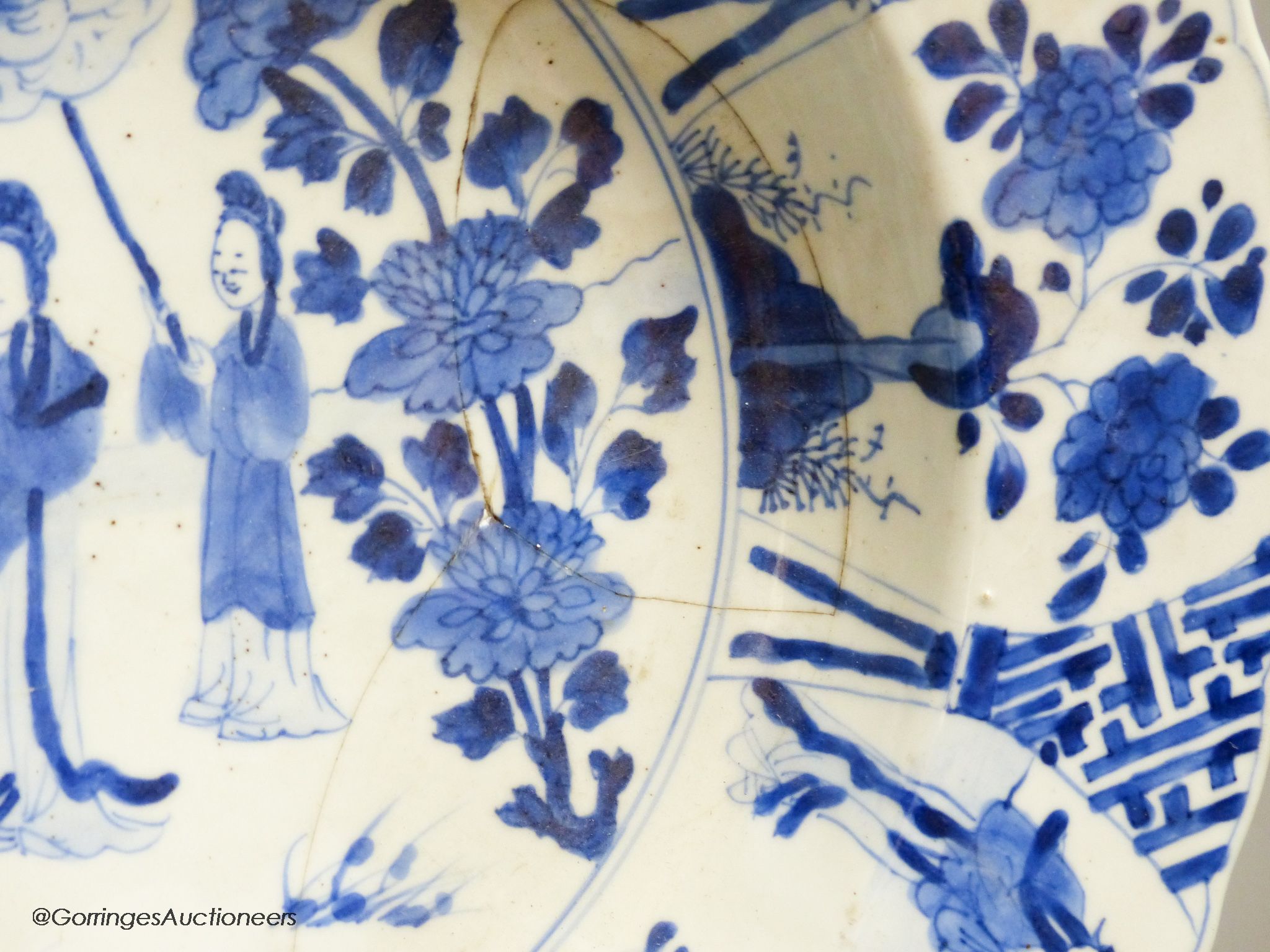 A Chinese blue and white dish, Kangxi mark and of the period, diameter 34cm, and a 19th century Chinese blue and white jar